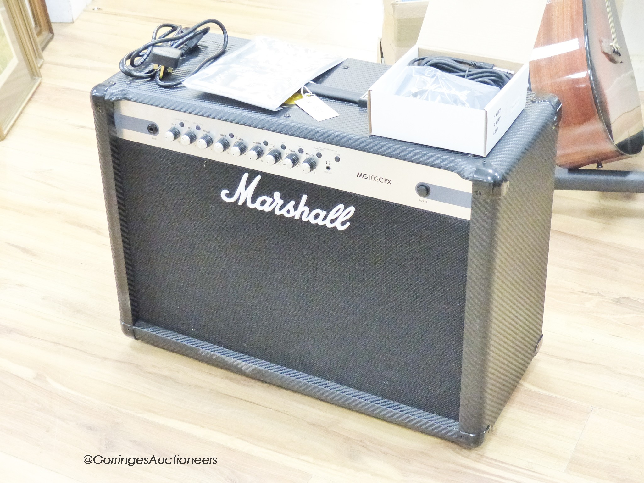 A Marshall MG 102 CF guitar amp with footswitch